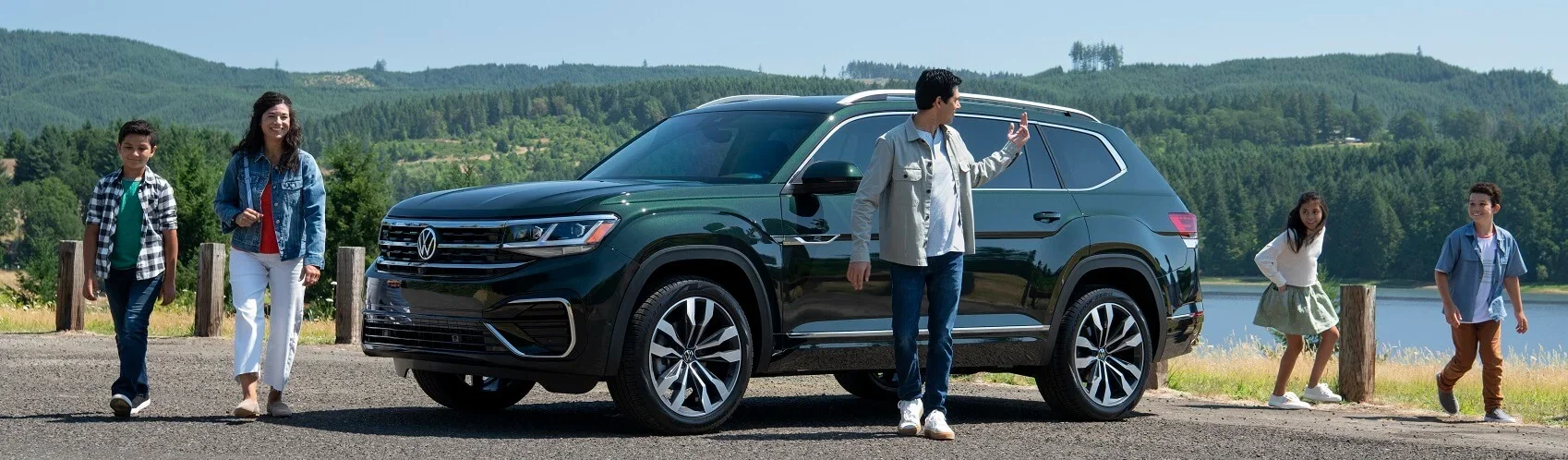Family Walking by Their New Volkswagen Tiguan