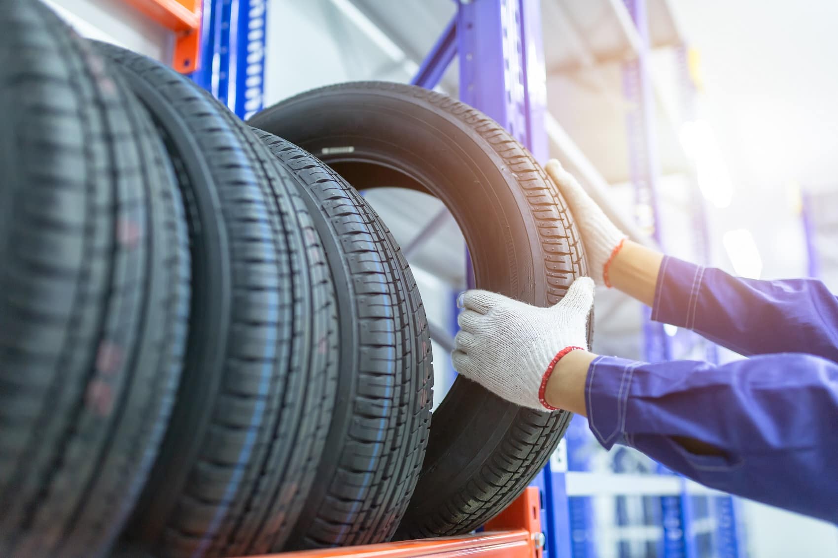 Technician Grabbing Tire